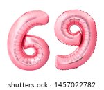 Number 69 sixty nine made of rose gold inflatable balloons isolated on white background. Pink helium balloons forming 69 sixty nine number