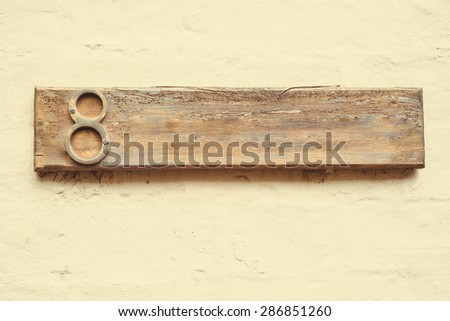Number 8 Eight digit wooden plate blank space for your text on plastered wall