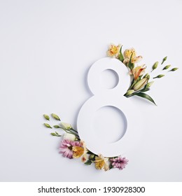 Number 8 With Fresh Spring Flowers With Green Leaves On Bright White Background. Minimal Women's Day, March 8th Or Birthday Concept. Flat Lay, Top View.