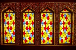 A Number Of Antique Stained Glass Windows Of Colored Vertical In The Form Of Rhombuses Of Red Yellow Blue Color. Architecture, Elements, Style, Middle Ages.