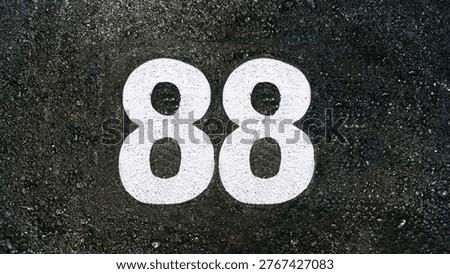 Number eighty eight, 88 on black asphalt                       