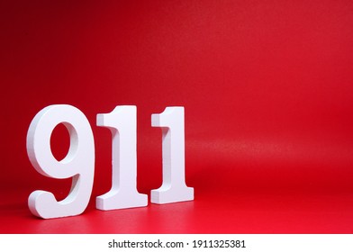 Number Nine One One ( 911 ) on Red Background with Copy Space - Police emergency call number Concept