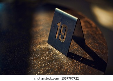 The number nineteen queue marker at a local coffee shop in Chiang Mai Thailand
