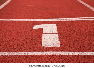 Number One. White Track Number On Red Rubber Racetrack, Texture Of Running Racetracks In Small Stadium