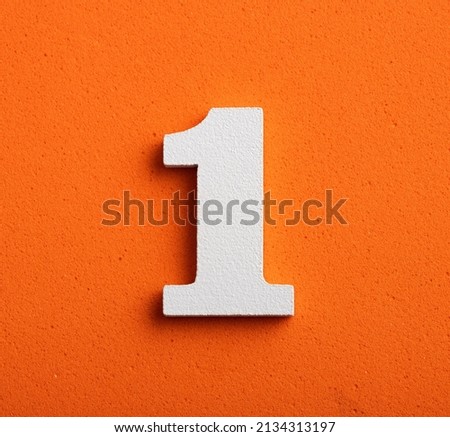 Number one - white number in wood on orange background