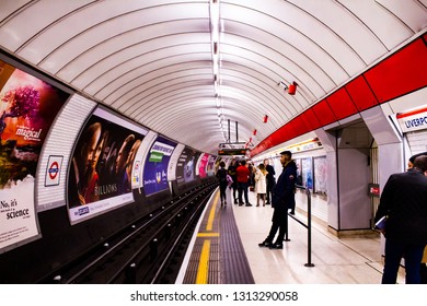 Number Of People Commuting, Waiting For A Tube On A Busy Platform At London Liverpool Street Station, England In March 2018 