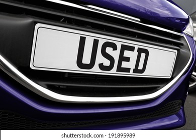 Number plate of a used cars for retail sale on a motor dealers forecourt all logos removed