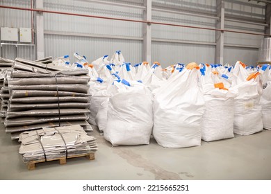 A Number Of Rolls Of Aluminum Lies In The Production Shop Of The Plant. Metal Processing, Aluminum Plant. Bags With Recycled Raw Materials Are Recycled.