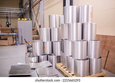 A Number Of Rolls Of Aluminum Lies In The Production Shop Of The Plant. Metal Processing, Aluminum Plant. Bags With Recycled Raw Materials Are Recycled.