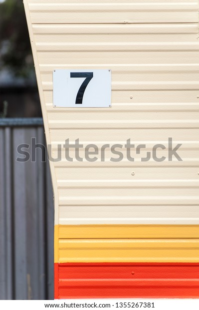 Number\
seven 7 sign for a cabin or van at a caravan\
park