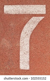 Number seven on the start of a running track - check my portfolio for other numbers