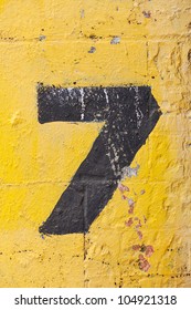 The Number Seven Painted On A Carpark Wall