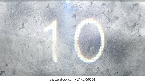 Number ten glowing brightly against textured, metallic background. Light reflections and subtle colors creating a futuristic and abstract feel - Powered by Shutterstock