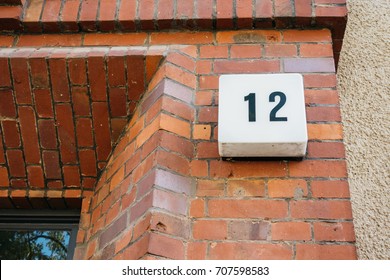 Number Twelve Sign On A Brick Wall