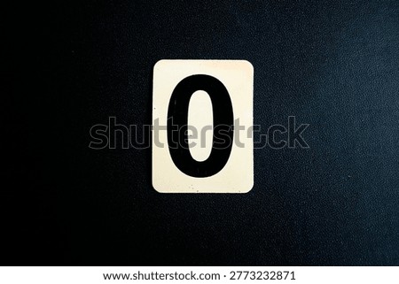 Number Zero on White Square Tile Isolated on Black Textured Background, Minimalist Single Digit Concept, Top View Starting Point Sign, Binary and Mathematical Null Element