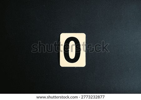Number Zero on White Square Tile Isolated on Black Textured Background, Minimalist Single Digit Concept, Top View Starting Point Sign, Binary and Mathematical Null Element