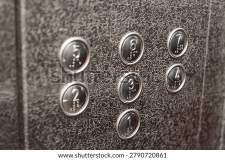 numbered floor buttons in elevator of multi-storey building