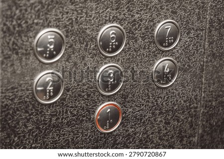 numbered floor buttons in elevator of multi-storey building