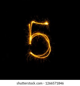 Numbers 0 to 9 created using a sparkler on black