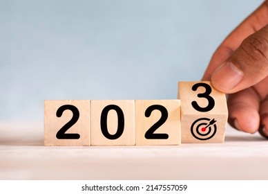 Numbers 2023 on a wooden cube Concept of setting goals for the next year - Shutterstock ID 2147557059
