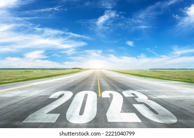 Numbers 2023 written on the road in the middle of an asphalt road at sunset. Concept of planning and tasks, business strategy, opportunities, hope, new life change symbol - Shutterstock ID 2221040799