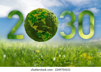 Numbers 2030 with green planet. A symbol of sustainable development and transition to renewable energy by 2030 year.