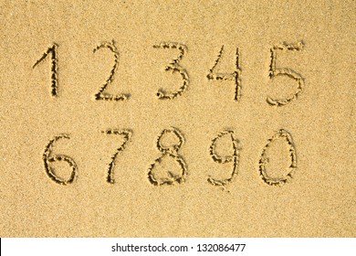 Numbers written on a sandy beach. (from one to ten)