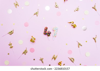 Numeral 41 in the form of donuts surrounded by decorative elements for party. Anniversary or birthday concept at the age of 41. Selective focus