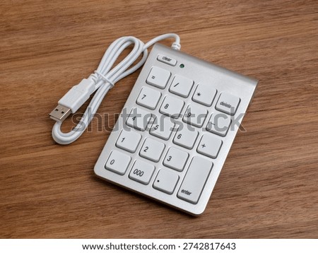 A numeric keypad on a computer placed on a table