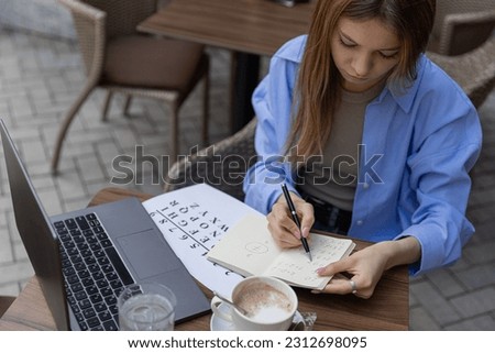 numerologist girl makes a calculation according to numerology, future by date of birth, find out her purpose with the help of numbers.top view High quality 4k footage Stock photo © 