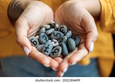 Numerology Numbers Concept. Numerology Calculate Life Path and Destiny Numbers. Many pebble stones with painted numbers in female palms