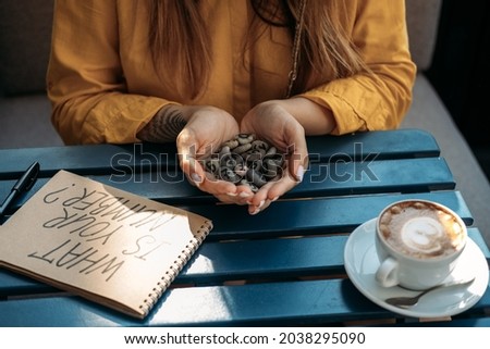 Numerology Numbers Concept. Numerology Calculate Life Path and Destiny Numbers. Female numerologist hand with text What Your Number and Many pebble stones with painted numbers. Stock photo © 
