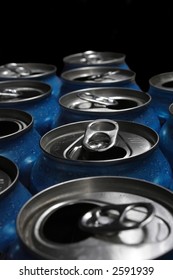 Numerous Aluminum Soda Pop Cans Over Black, Open.