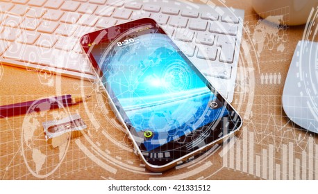 Numerous charts, screens and graphics over mobile phone in office