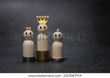 Numerous coins are stacked in a graph with wooden figurines. Up and down arrow of businessman averaging percentage dividend for idea of saving money and financial planning.