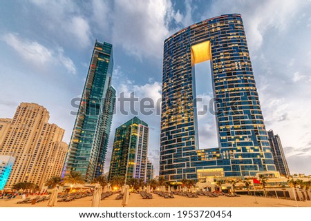 Numerous skyscrapers with hotels and residential buildings on the Gulf coast in Dubai. Concept of recreation and commercial real estate