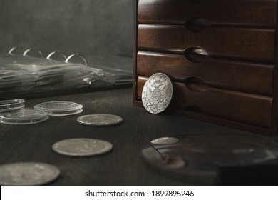 Numismatics. Old Collectible Coins On A Woden Table.