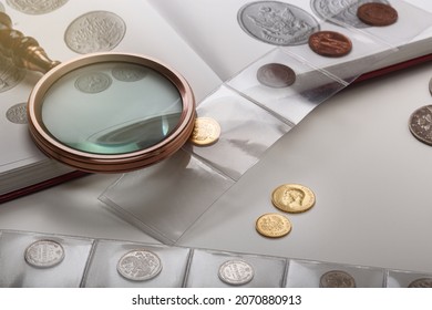 Numismatics. Old collectible coins on a table. light background.