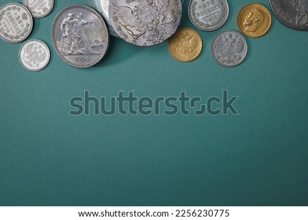 Numismatics. Old collectible coins on the table. Top view. Copy space for your text