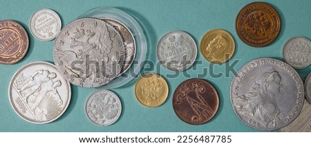 Numismatics. Old collectible coins on the table. Top view. Banner