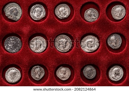 Numismatics.Authentic silver denarius, antoninianus of ancient Rome. A collector holds an old coin.Ancient coin of the Roman Empire