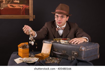 Numismatist With His Coin Collection