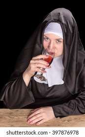 Nun Drinking Wine And Looking Up