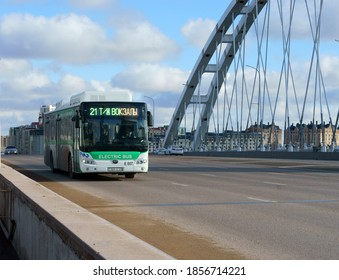 NUR SULTAN, KAZAKHSTAN - NOV 15, 2020: Electric Bus On Arch Bridge Over Ishim River