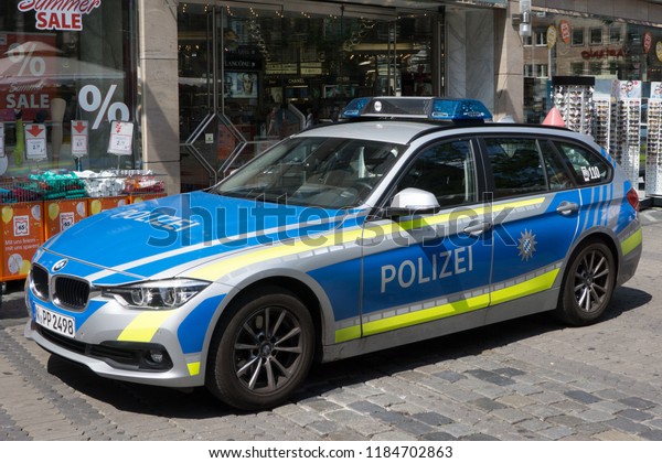 NUREMBERG, GERMANY - AUGUST 3, 2018: A Bavarian\
State Police car in Nuremberg. The Bavarian State Police has\
approximately 33,500 armed officers and roughly 8,500 other\
civilian employees in\
Germany.