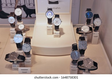 NUREMBERG, GERMANY - MAY 7, 2018: Nomos Watches In A Shop Window In Nuremberg, Germany. Nomos Glashutte Is A German Watch Making Company Since 1990.