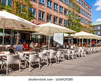 Nuremberg, Germany, On August 21, 2018. People Have Rest In Typical Cafe In Old Town