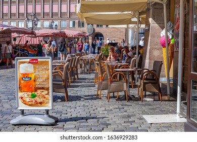 Nuremberg, Germany, On August 21, 2018. People Have Rest In Typical Cafe In Old Town