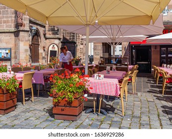 Nuremberg, Germany, On August 21, 2018. People Have Rest In Typical Cafe In Old Town