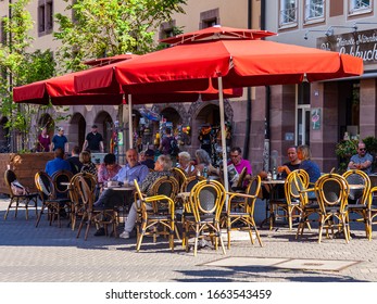 Nuremberg, Germany, On August 21, 2018. People Have Rest In Typical Cafe In Old Town